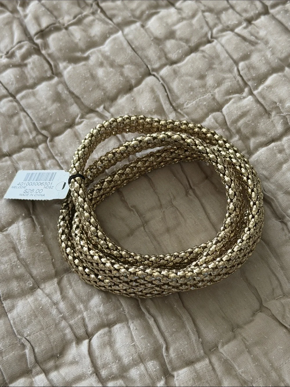 Set of three new with tags gold tone bracelet stretch